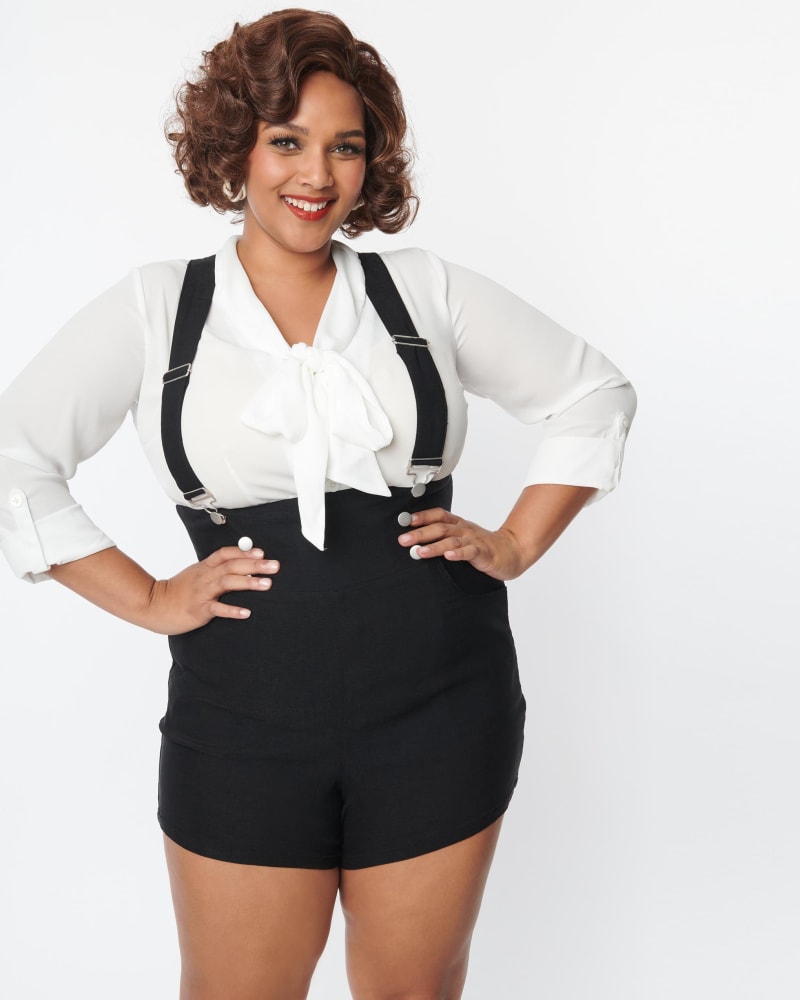 Front of a model wearing a size 4X Unique Vintage Black Pinafore Shorts in Black by Unique Vintage. | dia_product_style_image_id:287196